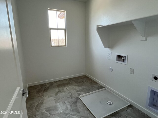 clothes washing area featuring electric dryer hookup, washer hookup, tile patterned flooring, and hookup for a gas dryer