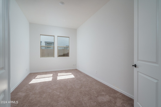 empty room featuring light colored carpet