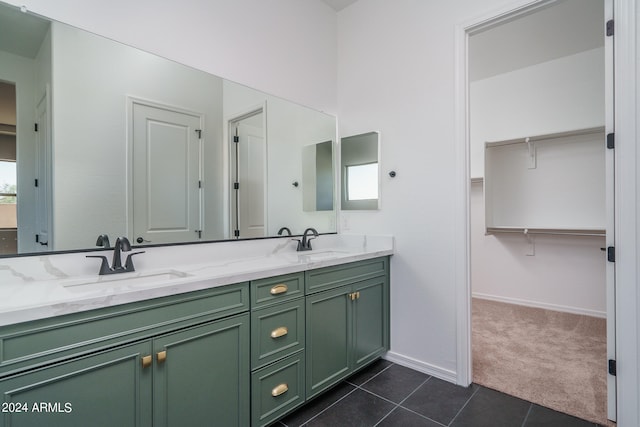 bathroom with tile patterned flooring and vanity