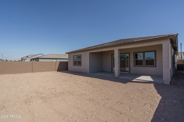 rear view of house with a patio