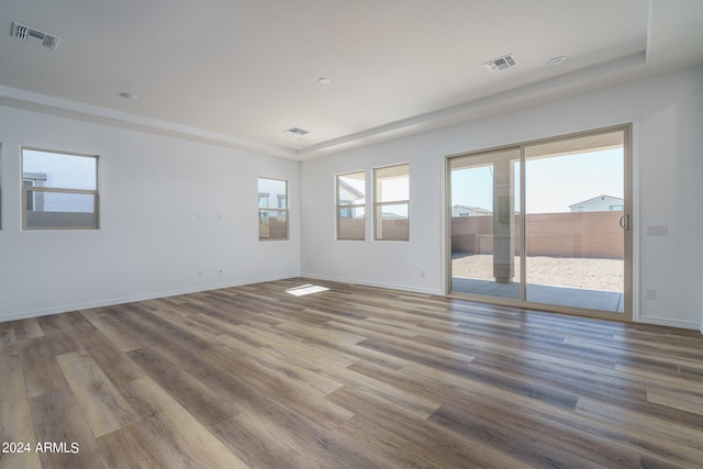 spare room featuring wood-type flooring