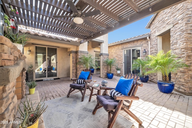 view of patio with ceiling fan and a pergola