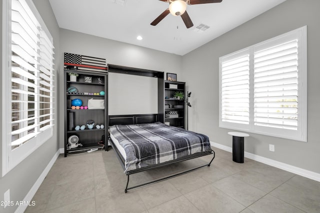 tiled bedroom with ceiling fan