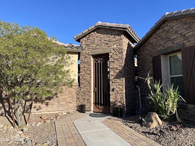 doorway to property featuring a patio area