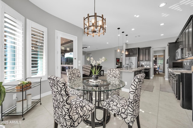 dining room featuring an inviting chandelier and light tile patterned floors