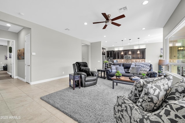 tiled living room with ceiling fan