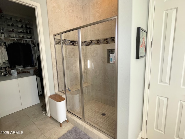 bathroom featuring tile patterned flooring and walk in shower