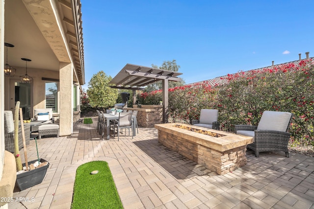 view of patio / terrace with a pergola and an outdoor fire pit