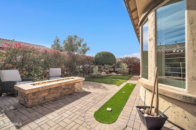 view of patio / terrace featuring a fire pit