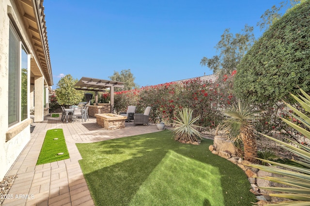 view of yard featuring a fire pit, a pergola, and a patio area