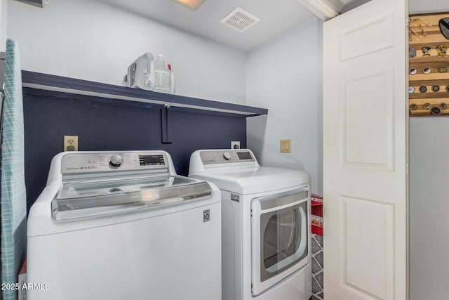 laundry area featuring washing machine and clothes dryer