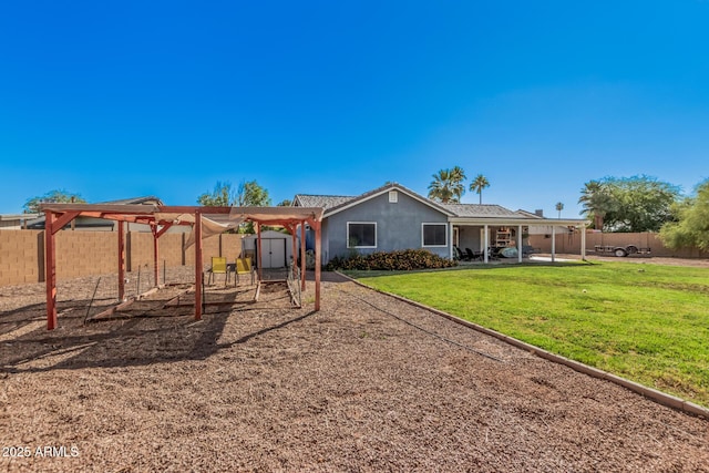 back of property featuring a shed, an outbuilding, a patio area, and stucco siding