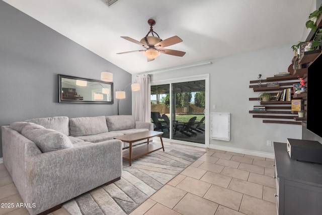 living area with ceiling fan, light tile patterned floors, lofted ceiling, and baseboards