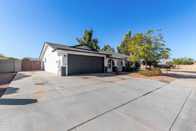 ranch-style home featuring a garage