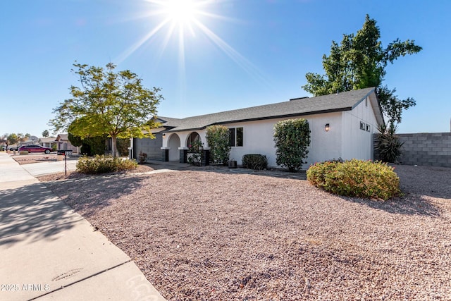 single story home with a garage