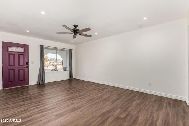 interior space featuring ceiling fan and dark hardwood / wood-style flooring