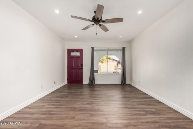 entrance foyer with ceiling fan and dark wood-type flooring