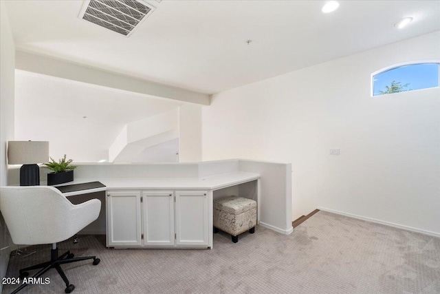 home office with light colored carpet