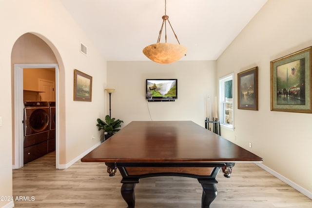 game room featuring light wood-type flooring, pool table, and washer and dryer