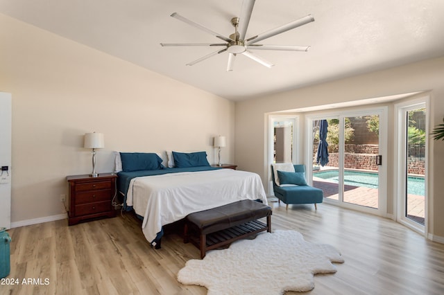 bedroom featuring light hardwood / wood-style floors, ceiling fan, and access to exterior