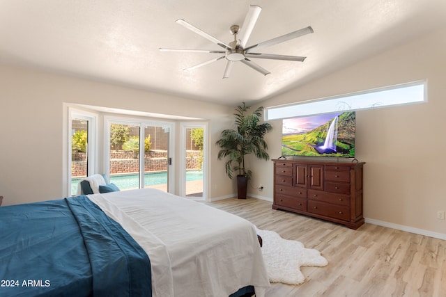 bedroom with light wood-type flooring, lofted ceiling, ceiling fan, and access to outside