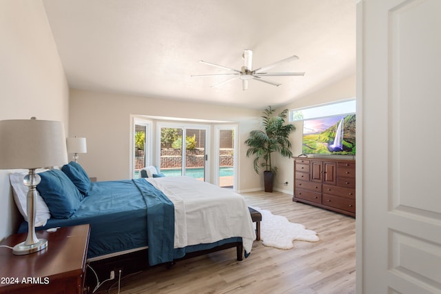 bedroom featuring ceiling fan, light wood-type flooring, access to outside, and lofted ceiling