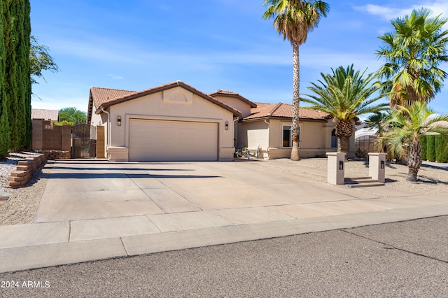 mediterranean / spanish-style home with a garage