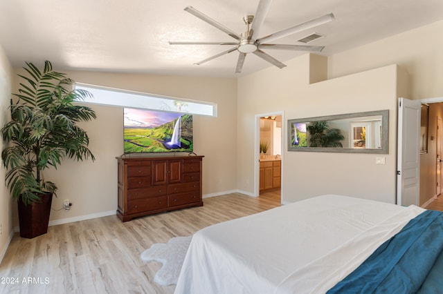 bedroom with light hardwood / wood-style flooring, vaulted ceiling, ceiling fan, and ensuite bathroom