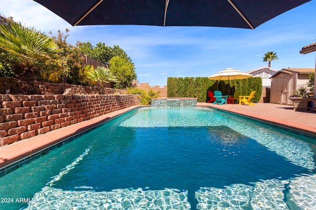 view of swimming pool featuring a patio area