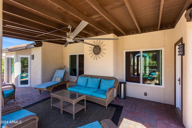 view of patio with outdoor lounge area and ceiling fan