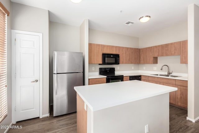 22125 N 29th Ave Unit 158, Phoenix, AZ 85027 - kitchen with black appliances, a sink, dark wood-style floors, and light countertops