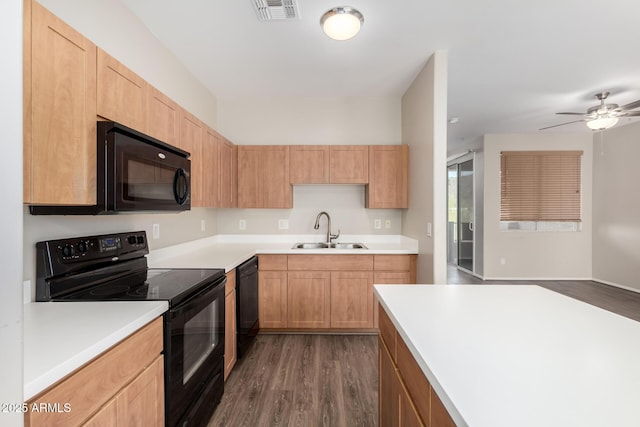 22125 N 29th Ave Unit 158, Phoenix, AZ 85027 - kitchen featuring black appliances, a sink, dark wood-type flooring, and light countertops
