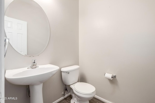 22125 N 29th Ave Unit 158, Phoenix, AZ 85027 - half bath featuring baseboards, wood finished floors, and toilet