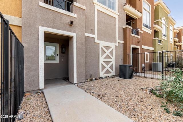 22125 N 29th Ave Unit 158, Phoenix, AZ 85027 - property entrance featuring stucco siding and central air condition unit