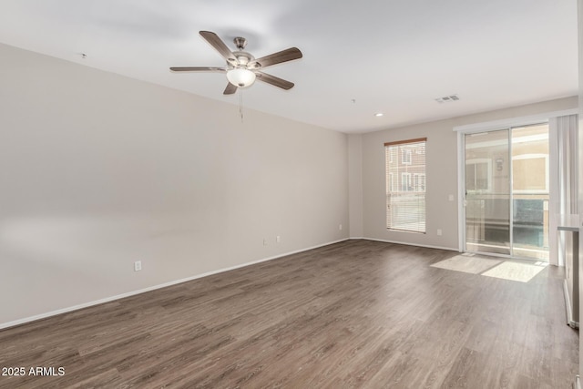 22125 N 29th Ave Unit 158, Phoenix, AZ 85027 - unfurnished room with wood finished floors, a ceiling fan, and baseboards