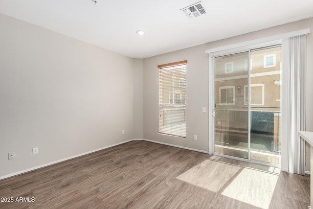 22125 N 29th Ave Unit 158, Phoenix, AZ 85027 - empty room with wood finished floors, baseboards, and recessed lighting