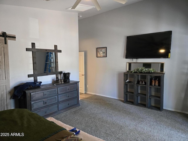 9016 W Fossil Creek Rd, Pine, AZ 85544 - carpeted living area featuring a barn door, ceiling fan, and baseboards
