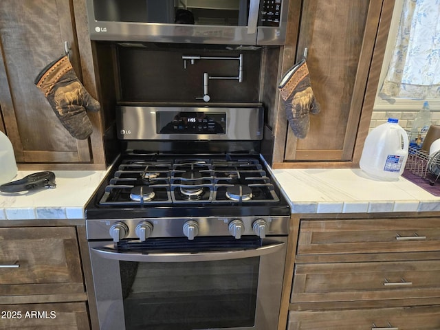 9016 W Fossil Creek Rd, Pine, AZ 85544 - kitchen with stainless steel appliances and light countertops