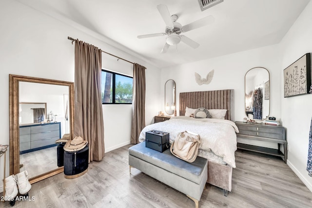 6215 E Surrey Ave, Scottsdale, AZ 85254 - bedroom featuring light wood finished floors and a ceiling fan