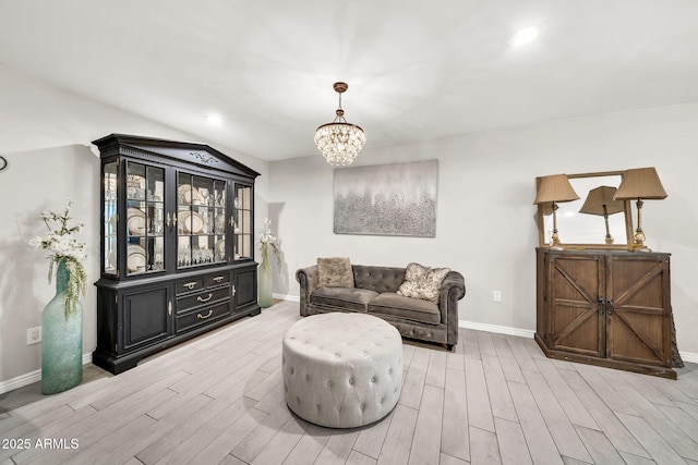 6215 E Surrey Ave, Scottsdale, AZ 85254 - living room featuring a chandelier, light wood finished floors, and recessed lighting