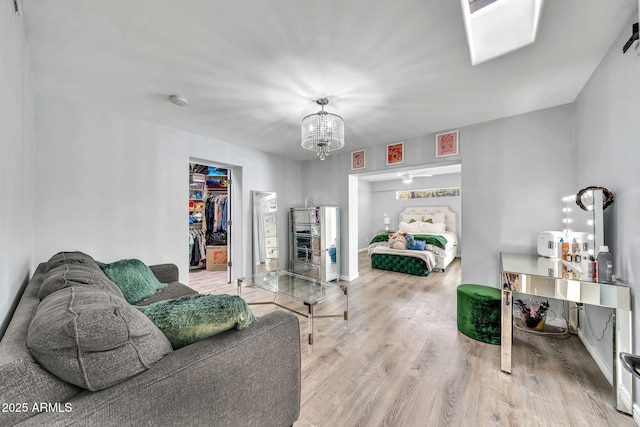 6215 E Surrey Ave, Scottsdale, AZ 85254 - living area featuring a chandelier and wood finished floors