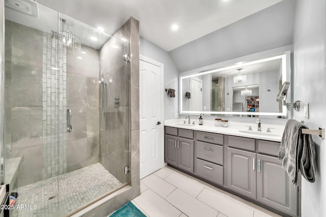 6215 E Surrey Ave, Scottsdale, AZ 85254 - full bathroom featuring double vanity, a shower stall, a chandelier, tile patterned floors, and recessed lighting