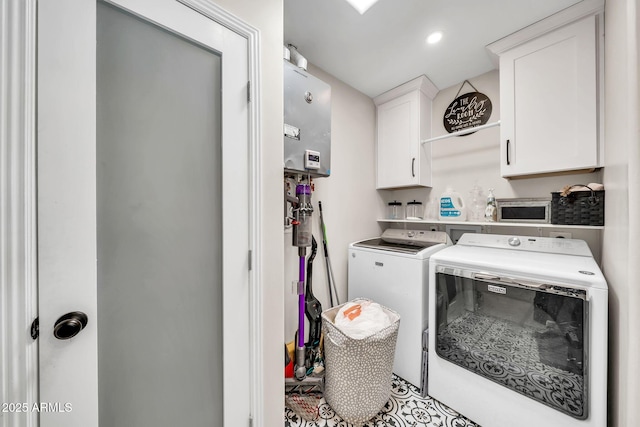 6215 E Surrey Ave, Scottsdale, AZ 85254 - washroom with washer and clothes dryer, cabinet space, water heater, and recessed lighting