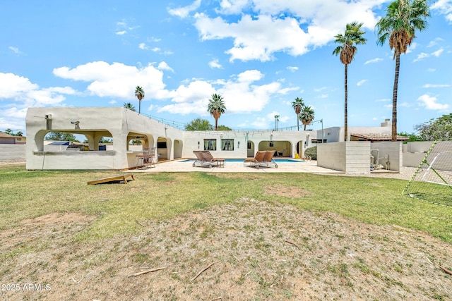 6215 E Surrey Ave, Scottsdale, AZ 85254 - view of grassy yard with an outdoor pool and a patio