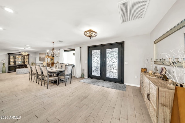 6215 E Surrey Ave, Scottsdale, AZ 85254 - foyer entrance featuring french doors, wood finished floors, a chandelier, and recessed lighting