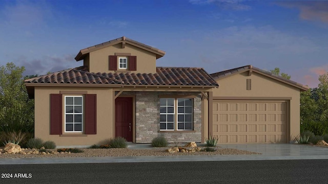 view of front of home featuring an attached garage, stone siding, a tiled roof, driveway, and stucco siding