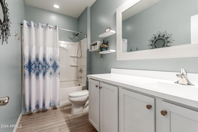 full bathroom featuring toilet, vanity, and shower / bath combination with curtain