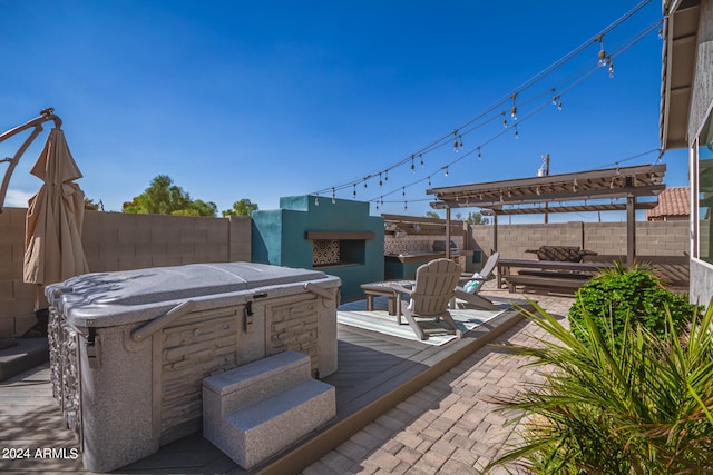 view of patio / terrace featuring a hot tub