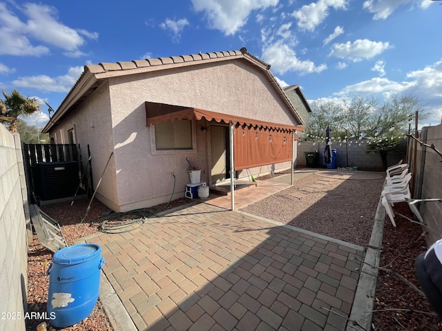 rear view of house featuring a patio