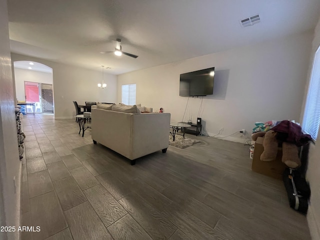 living room featuring hardwood / wood-style floors and ceiling fan